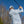 Man swinging a golf club in the late fall wearing a golfish quarter zip pullover